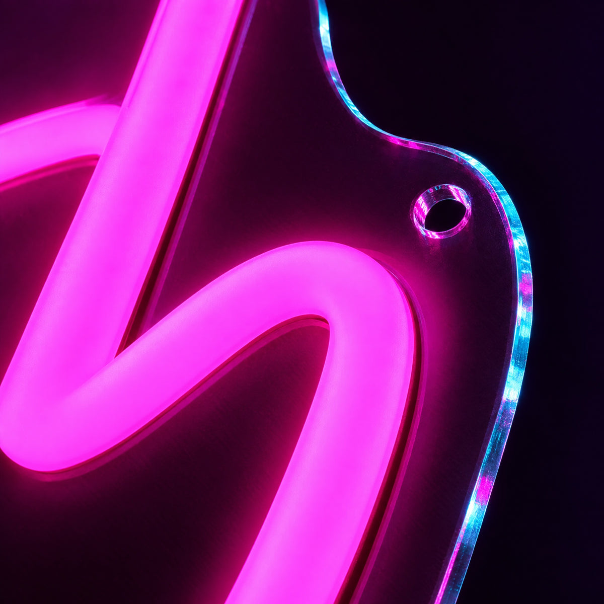 Macro close-up of the LED neon tube on its clear acrylic backboard with mounting hole