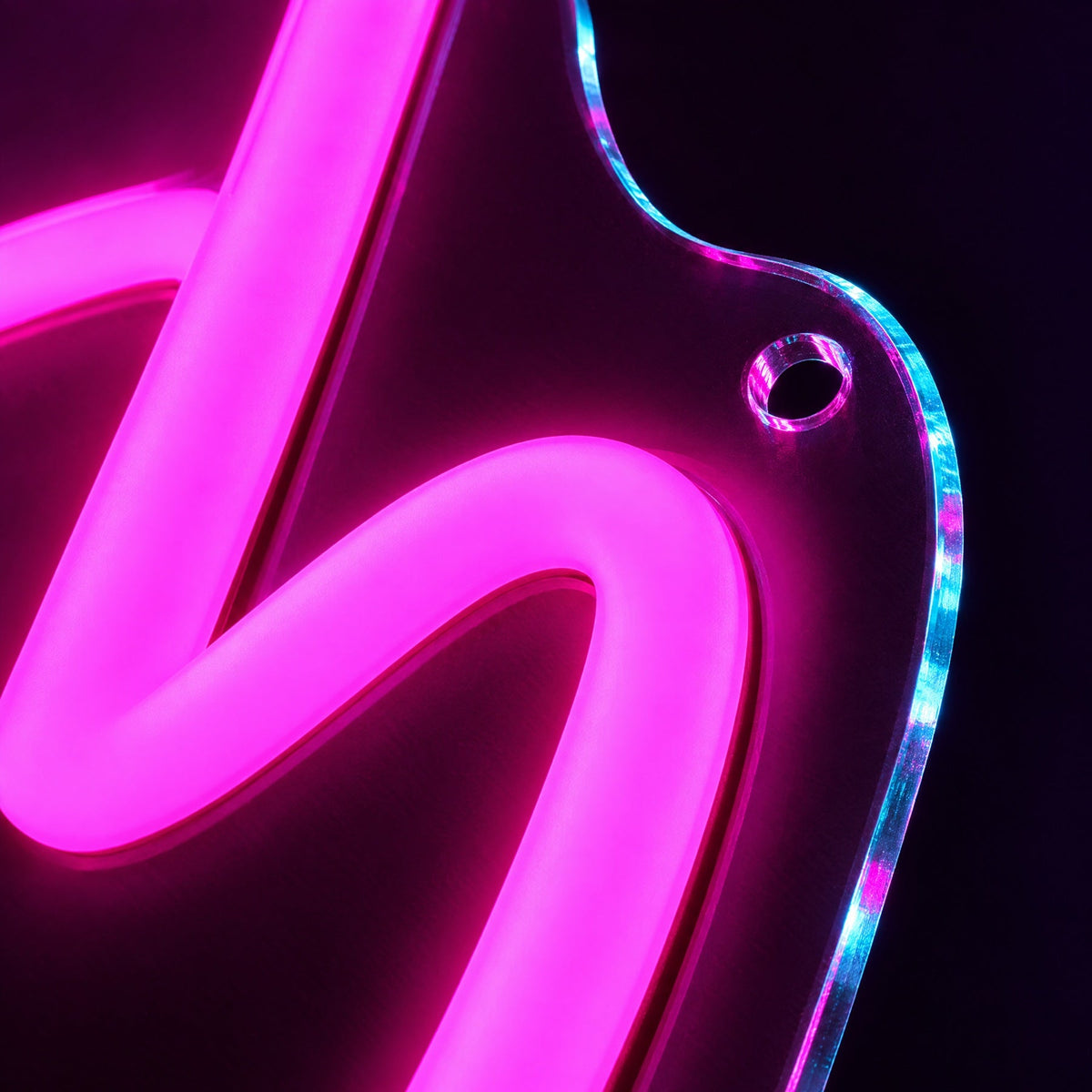 Macro close-up of the LED neon tube on its clear acrylic backboard with mounting hole
